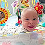 baby, smiling, playmat, toy, colorful, infant, face, happy, child, indoor, cute, babyclothes, softtoys, mesh, pattern, head, bright, fun, toddler, playtime