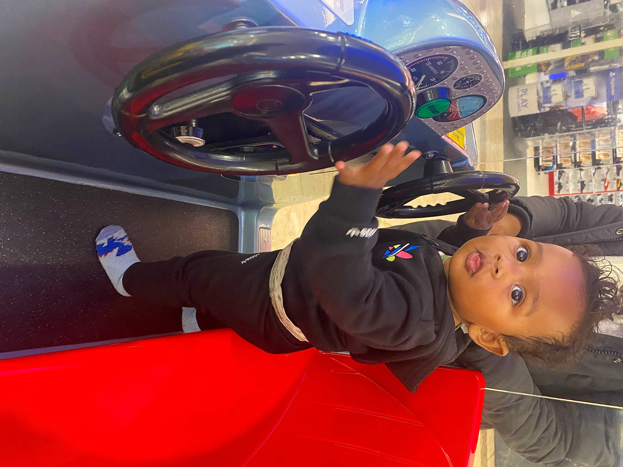 Carlo is registered to the contest to win money with this photo: astronaut, auto_part, automotive_design, automotive_exterior, automotive_lighting, automotive_tire, automotive_wheel_system, electric_blue, fun, headgear, helmet, hood, motor_vehicle, motorcycle_helmet, person, personal_protective_equipment, recreation, sports_gear, toddler, vehicle