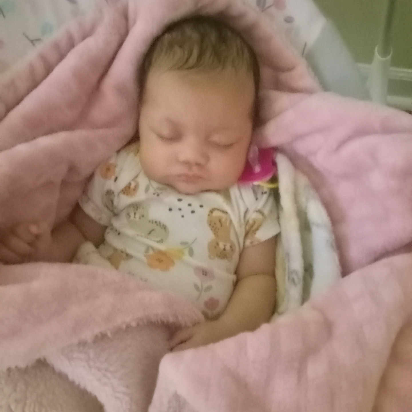 Cire is registered to the contest to win money with this photo: baby, blanket, child, clothing, comfort, cozy, cute, face, floral_pattern, head, indoor, infant, onesie, peaceful, pink, resting, sleeping, soft_texture, wrapped, young