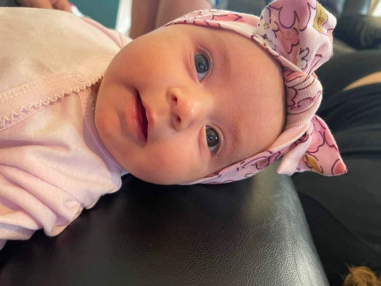 Labrea is registered to the contest to win money with this photo: baby, baby_toddler_clothing, cheek, child, eyebrow, eyelash, fashion_accessory, fun, happy, headwear, human_body, iris, lip, mouth, nose, person, portrait_photography, sitting, skin, sleeve