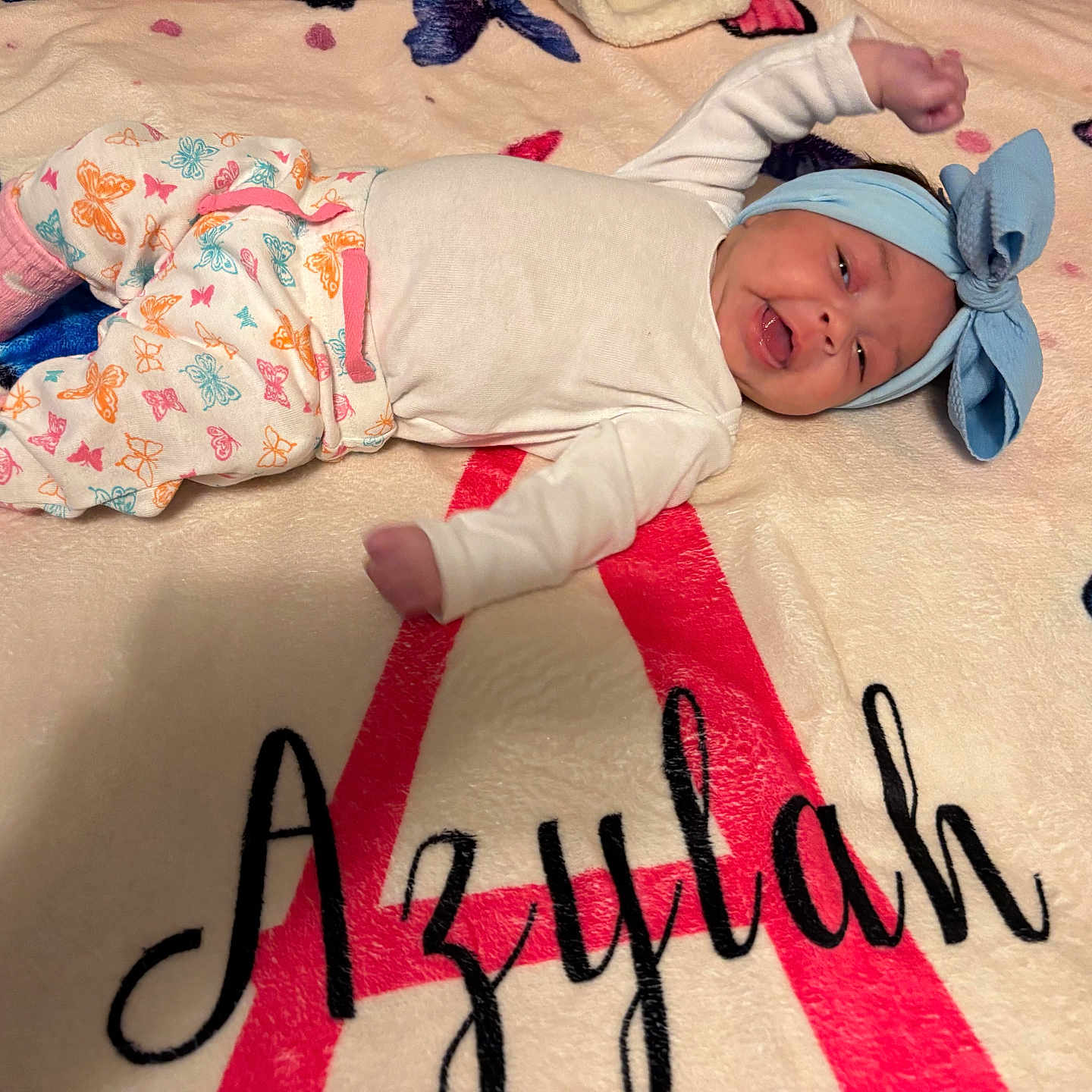 Azylah is registered to the contest to win money with this photo: baby, bed, blanket, bodypart, bonnet, cap, clothing, face, finger, furniture, glove, hand, hat, head, newborn, person, photography, portrait, quilt, text