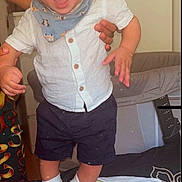 Kenan participe au concours pour gagner de l'argent avec cette photo : baby, bed, blanket, child, clothing, cute, fabric, footwear, furniture, hand, happy, indoor, mickey_mouse_shoes, navy_shorts, person, smiling, socks, standing, toddler, white_shirt