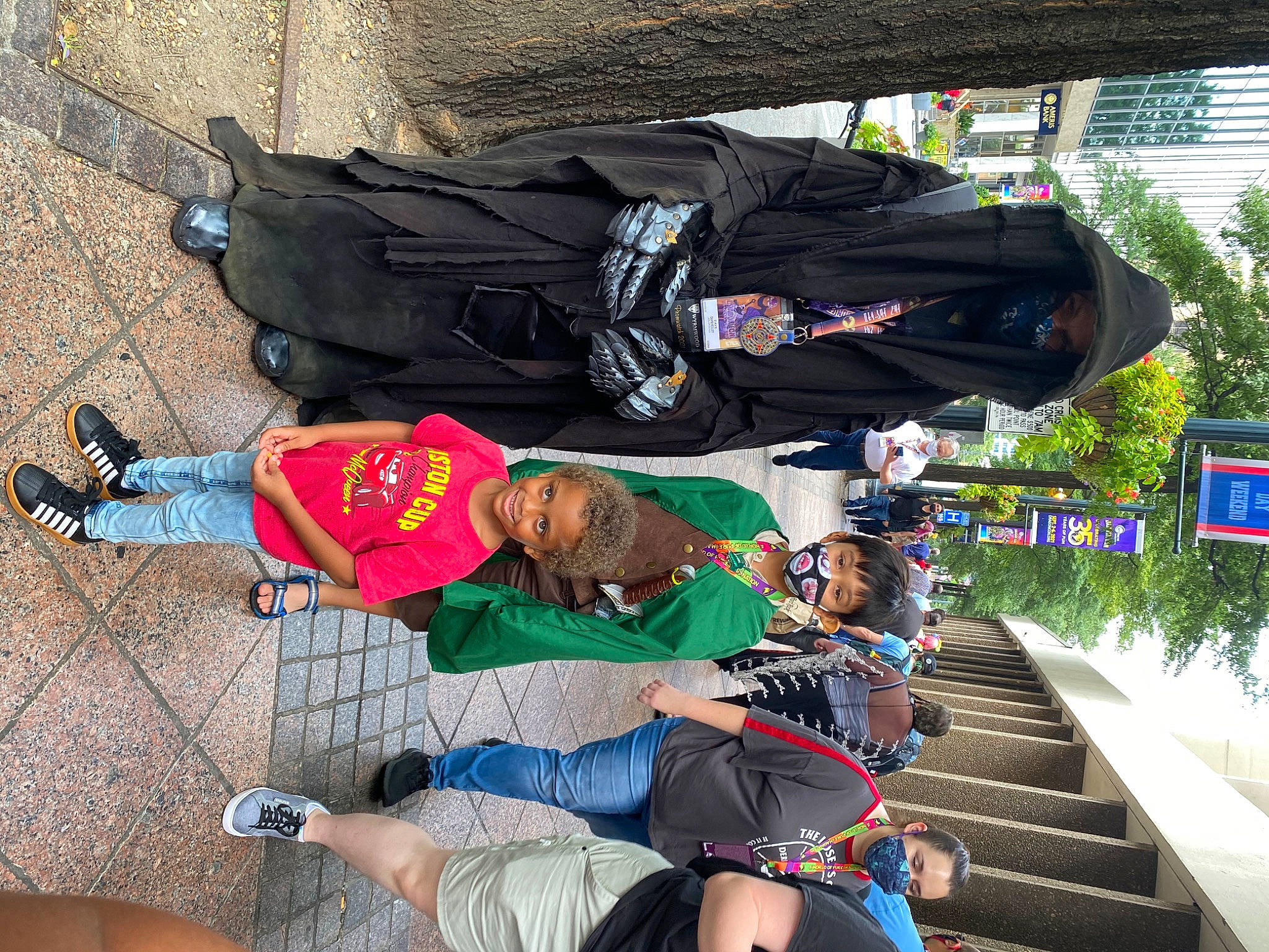 Kareem is registered to the contest to win money with this photo: backpack, bag, baggage, hat, joy, leisure, luggage_and_bags, person, plant, recreation, shoe, shorts, sneakers, stairs, thigh, travel, tree