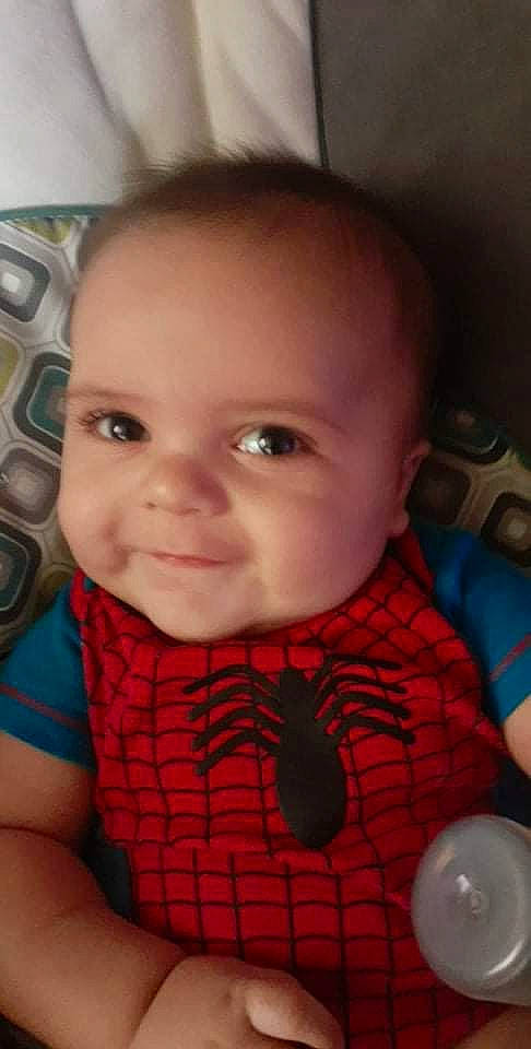 Jesse Kolton is registered to the contest to win money with this photo: baby, baby_toddler_clothing, cheek, chin, ear, eyebrow, eyelash, facial_expression, finger, forehead, iris, lip, mouth, neck, nose, organ, person, skin, sleeve, smile