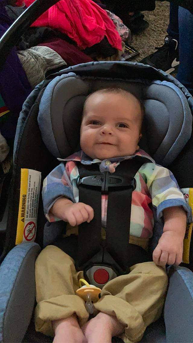 Jesse Kolton is registered to the contest to win money with this photo: auto_part, baby, baby_carriage, baby_products, baby_toddler_clothing, brown, car_seat, child, comfort, fun, person, product, sitting, smile, toddler, travel
