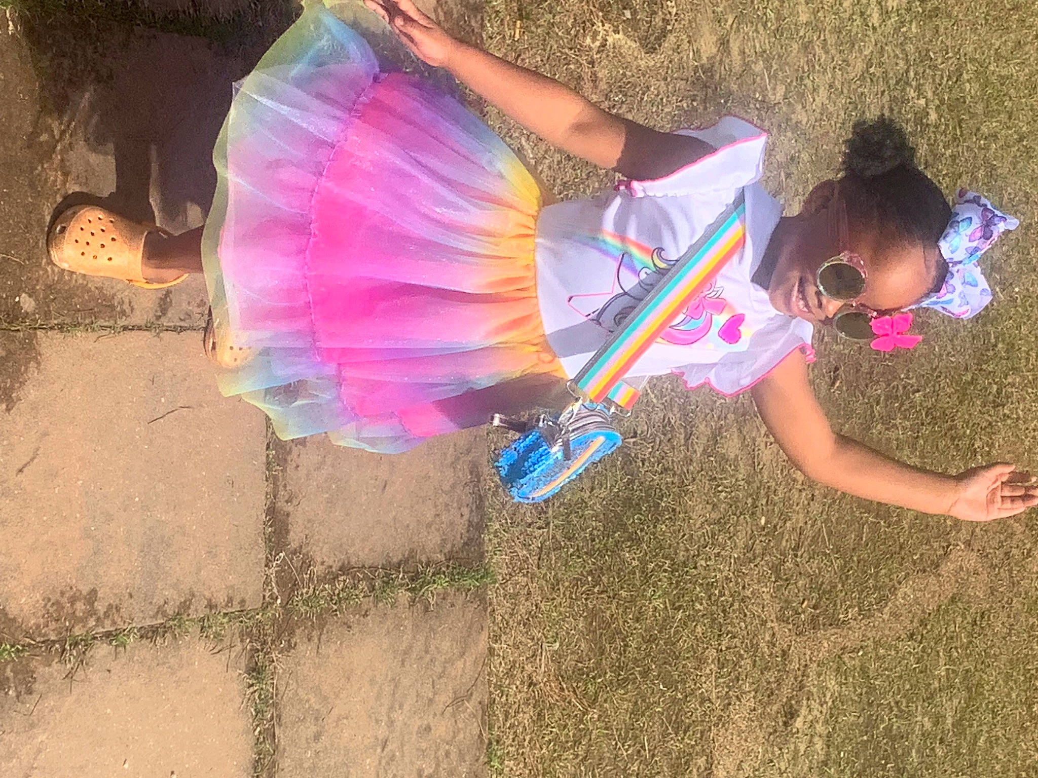 Skai joined the competition — help win amazing prizes! child, cool, electric_blue, fashion_accessory, fun, grass, happy, human_leg, leisure, liquid_bubble, magenta, people_in_nature, person, pink, sand, shadow, soil, tints_and_shades, toddler, umbrella
