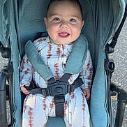 Weston joined the competition — help win amazing prizes! baby, smiling, stroller, child, outdoor, happy, infant, clothing, seatbelt, cute, person, toddler, jumpsuit, tie_dye, transportation, wheel, daylight, safety, cute_expression, baby_girl_or_boy