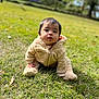 baby, child, grass, outdoor, nature, cute, onesie, infant, portrait, young, sitting, greenery, curious, face, person, clothing, daylight, soft, young_child, casual