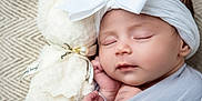Kehlani is registered to the contest to win money with this photo: baby, blanket, bow, closeup, cute, fabric, face, foot, hand, headband, indoors, infant, newborn, peaceful, pearl, portrait, ribbon, sleeping, soft_toy, teddy_bear