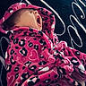 baby, infant, yawning, pink_robe, leopard_print, hooded_clothing, sleepy, cute, child, soft_texture, patterned_fabric, portrait, indoor, cozy, small_child, apparel, resting, close_up, warm_clothing, person