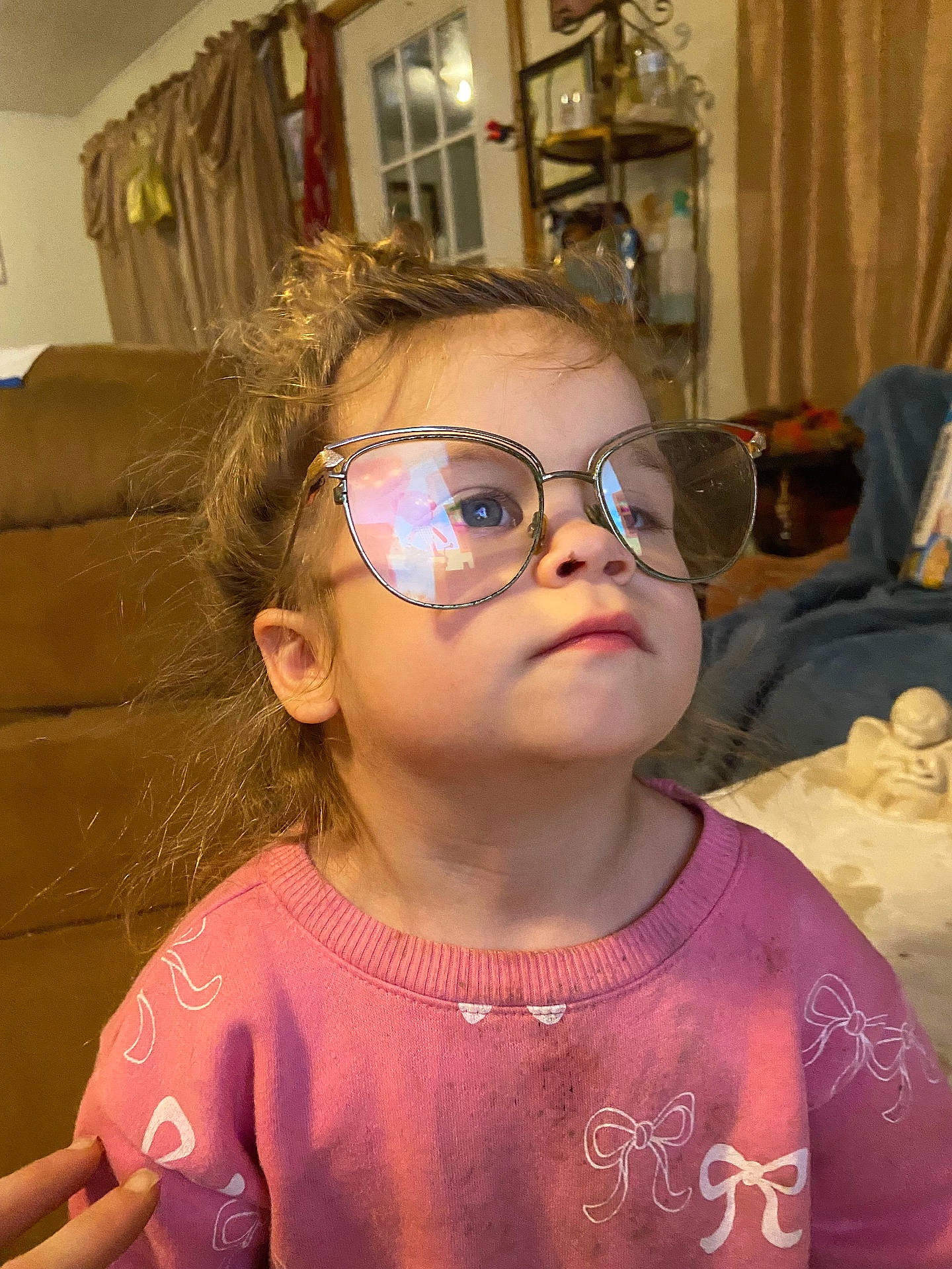 Bray joined the competition — help win amazing prizes! bow_pattern, child, couch, cute, dirty_clothes, eyewear, face, gaze_up, glasses, hand, home, indoor, living_room, messy_hair, nose, pink_sweater, portrait, reflection, soft_lighting, toddler