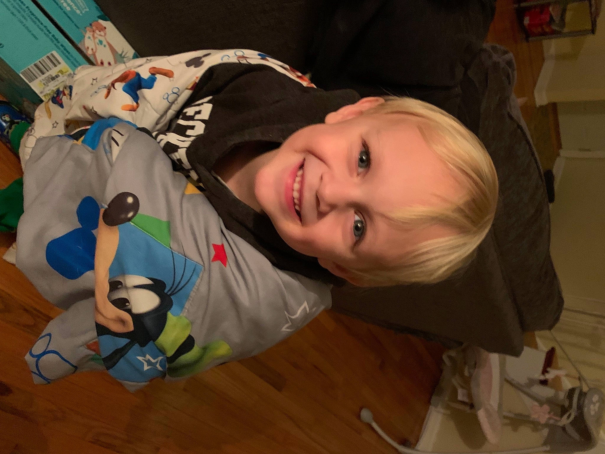 Nathaniel is registered to the contest to win money with this photo: baby, baby_products, baby_toddler_clothing, cheek, child, comfort, flooring, fun, happy, hardwood, iris, joy, laugh, mouth, nose, person, sitting, smile, toddler, toy