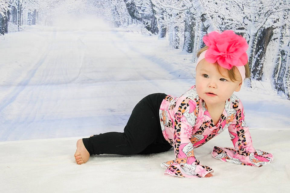 Everleigh is registered to the contest to win money with this photo: baby, baby_toddler_clothing, beauty, cap, child, fashion_accessory, flower, freezing, fun, happy, headgear, headwear, leisure, magenta, pattern, person, petal, recreation, sleeve, snow