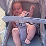 Gracie-May is registered to the contest to win money with this photo: baby, stroller, infant, child, outdoor, seatbelt, canopy, orange_outfit, plush_toy, foot, hand, face, head, sunlight, shade, fabric, comfort, cute, small_person, expression