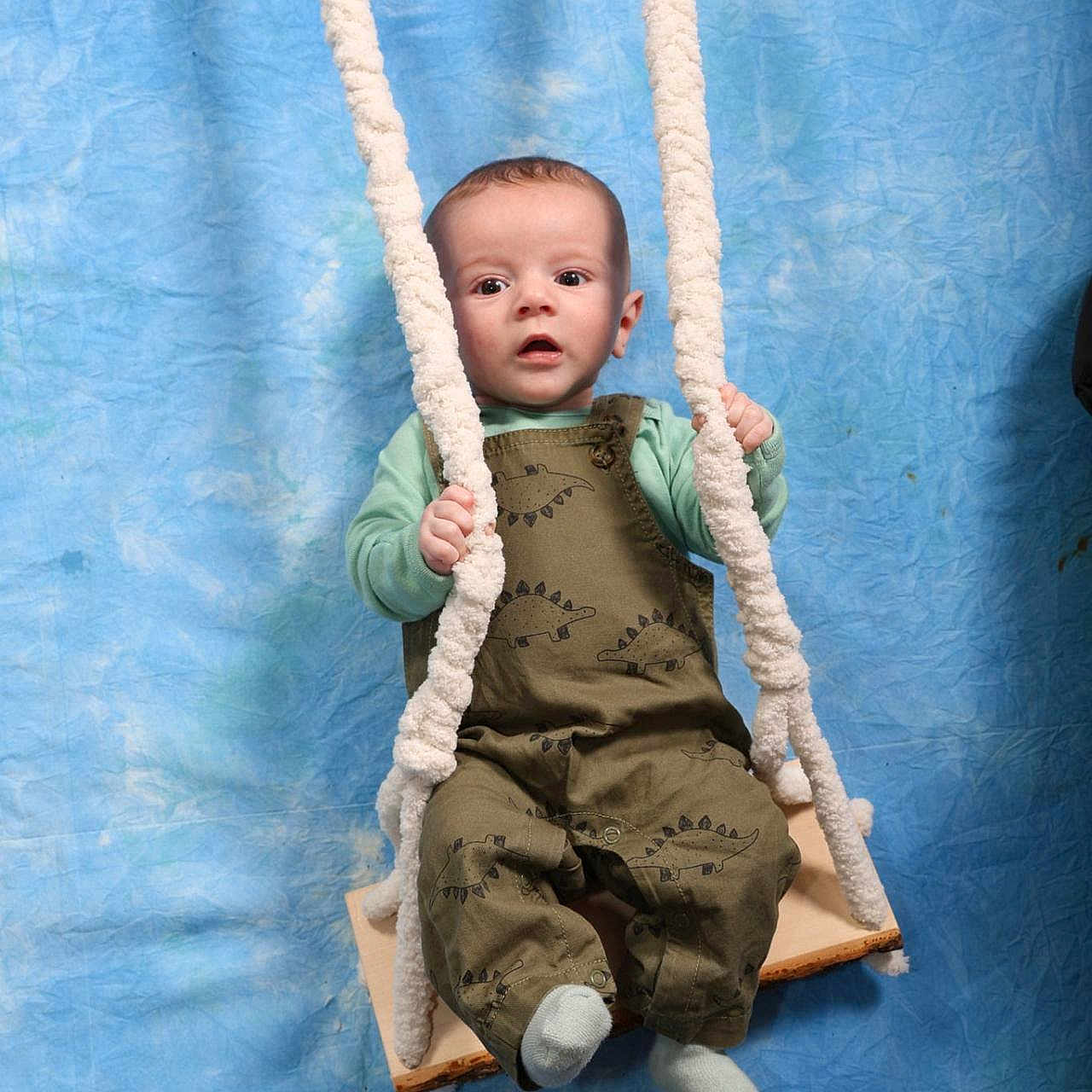Kenneth is registered to the contest to win money with this photo: baby, clothing, face, furniture, grass, head, hosiery, nature, outdoorplayarea, outdoors, pants, park, person, photography, playarea, portrait, sitting, sock, swing, toy