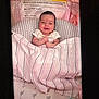 Delilah P. joined the competition — help win amazing prizes! baby, blanket, baby_seat, warning_label, striped_blanket, infant, smiling, clothing, fabric, indoor, child, cute, person, face, head, comfort, soft, toddler, happy, resting
