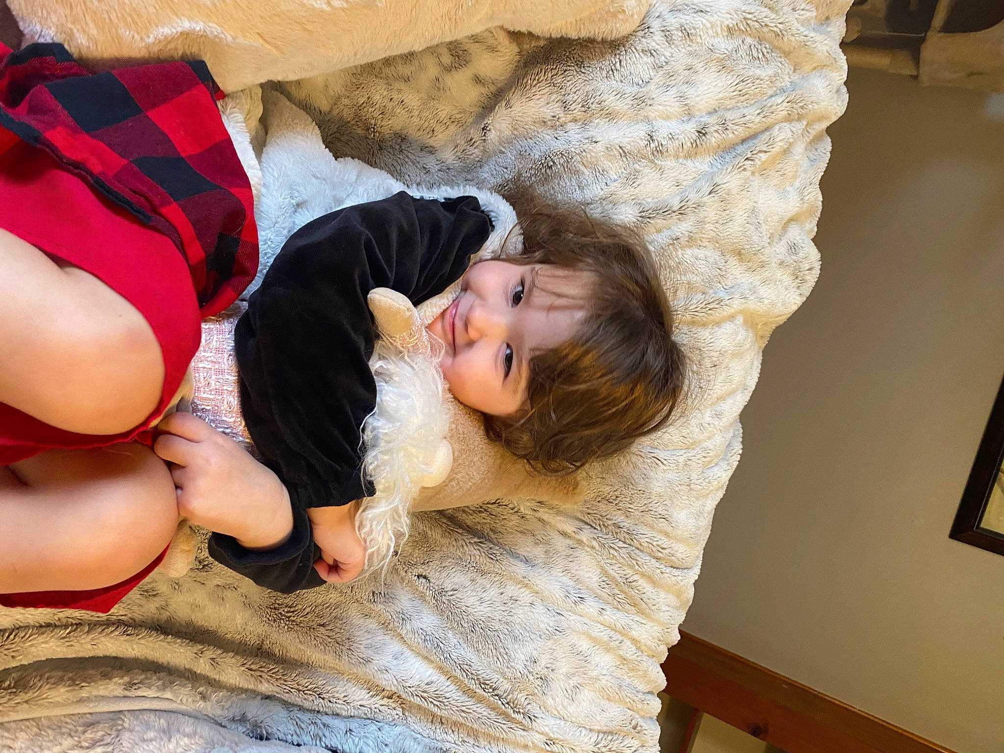 Thea is registered to the contest to win money with this photo: baby, barefoot, child, comfort, floor, flooring, foot, fun, fur, happy, hardwood, human_leg, joy, leisure, linens, person, room, sitting, skin, toddler
