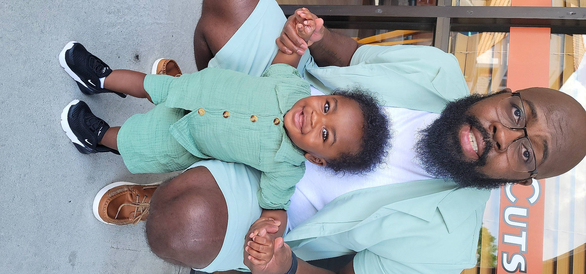 Orion is registered to the contest to win money with this photo: abdomen, arm, beard, bookcase, child, comfort, elbow, event, gesture, hand, happy, joint, joy, knee, mouth, person, shelf, smile, thigh, thumb