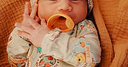 River joined the competition — help win amazing prizes! adorable, baby, blanket, child, comfortable, cozy, cute, cute_expression, hat, indoor, infant, newborn, onesie, pacifier, portrait, sleepwear, small_hands, soft, warm, wrapped