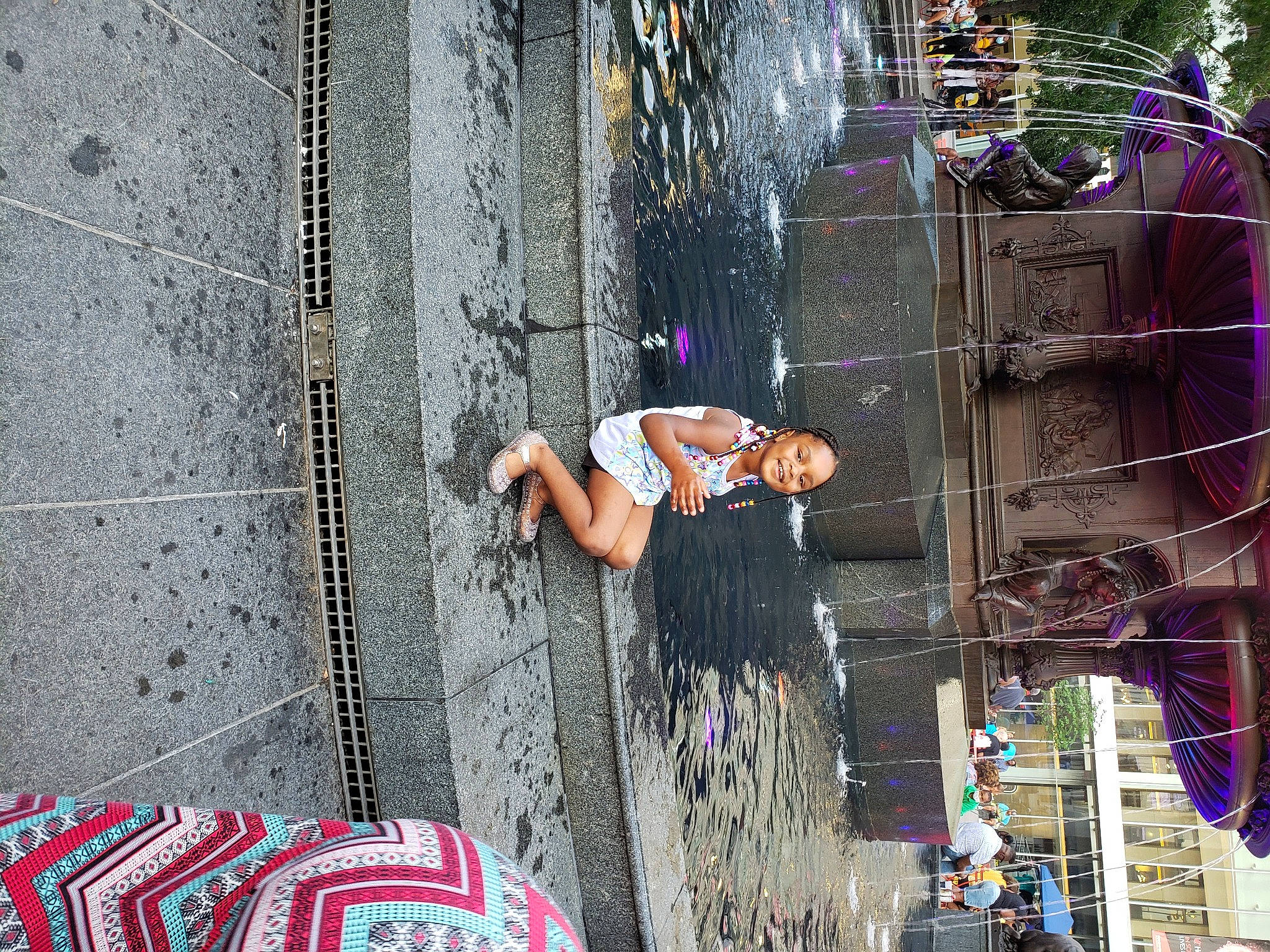 Cheyenne is registered to the contest to win money with this photo: child, city, fun, joy, leisure, magenta, pedestrian, person, pink, purple, recreation, road, sidewalk, street, street_fashion, textile, toddler, travel, tree, visual_arts