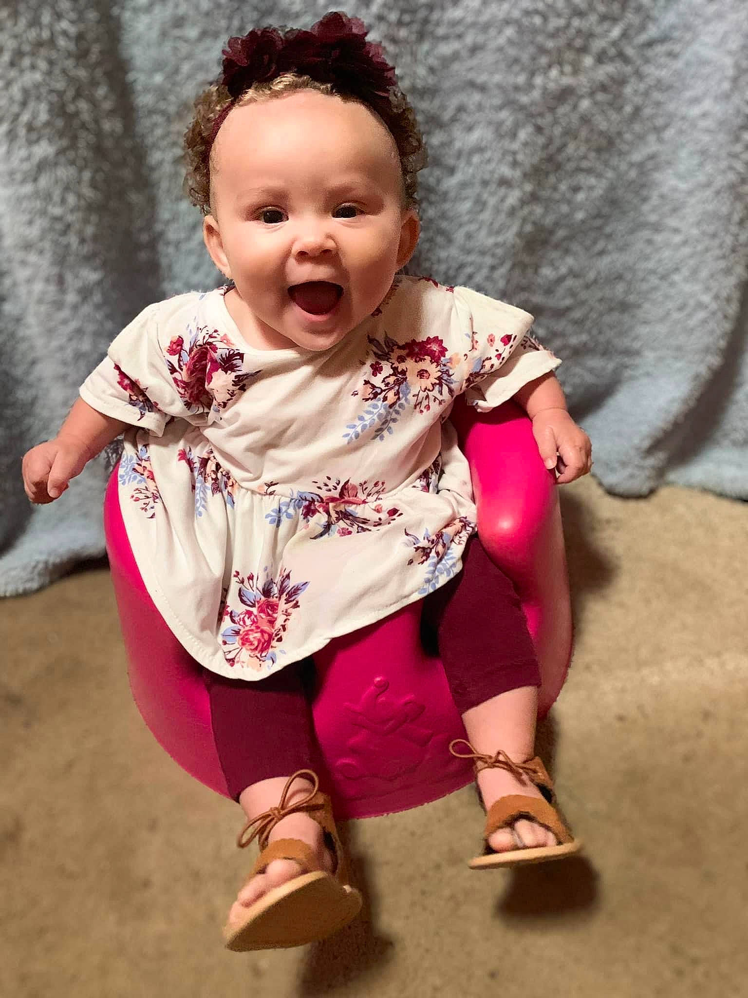 Mckinley is registered to the contest to win money with this photo: baby, baby_toddler_clothing, cheek, child, fun, happy, headwear, lip, magenta, nose, pattern, person, pink, play, portrait_photography, sandal, sitting, skin, sleeve, smile