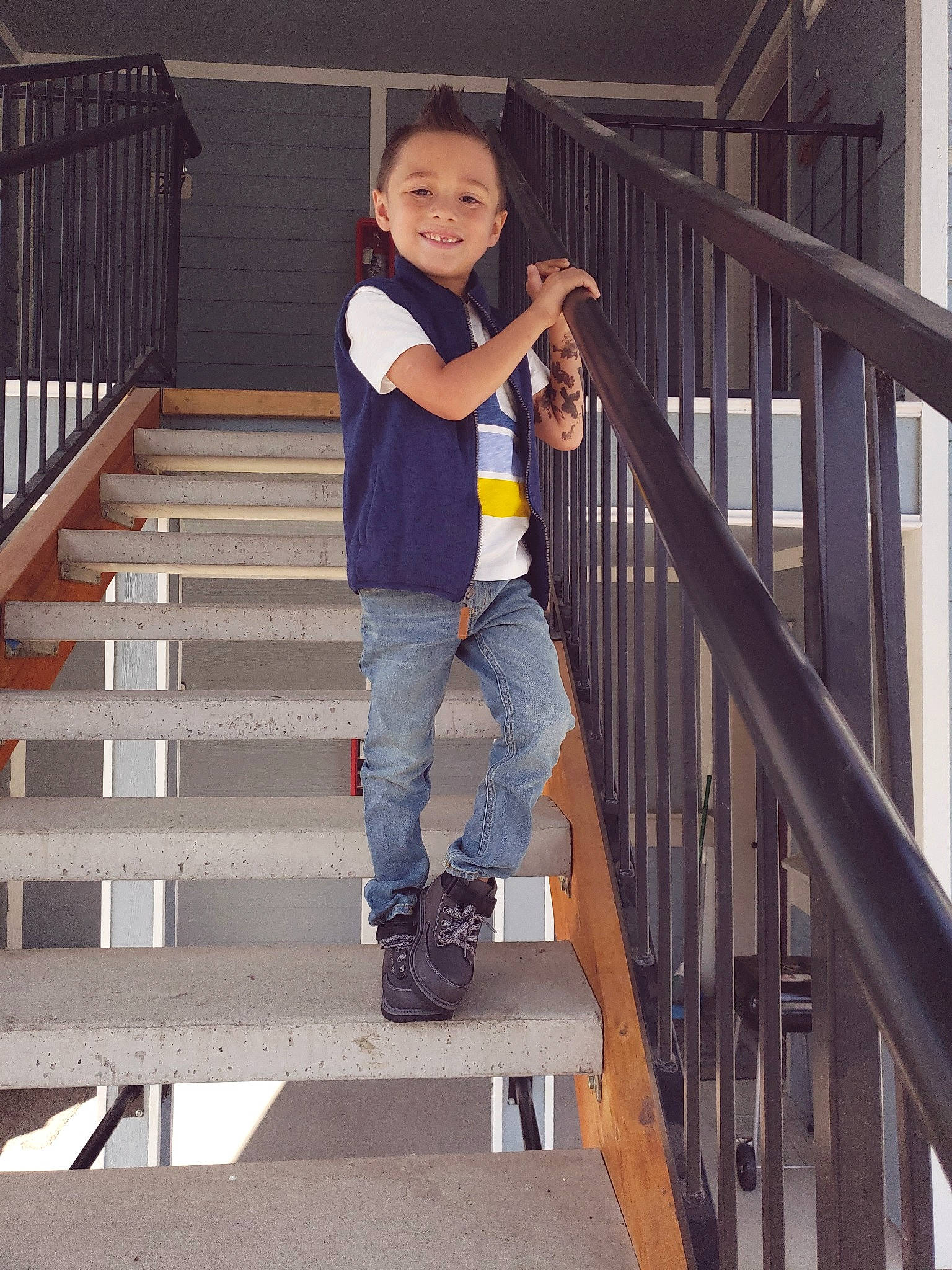 Caydence is registered to the contest to win money with this photo: baluster, denim, footwear, guard_rail, handrail, jeans, joy, person, shoe, stairs, toddler, trousers