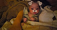 Mary is registered to the contest to win money with this photo: baby, infant, child, portrait, sitting, blanket, swaddle, couch, home, indoor, face_filter, puppy_filter, dog_ears, dog_nose, cute, eyes, hands, textile, cozy, photography