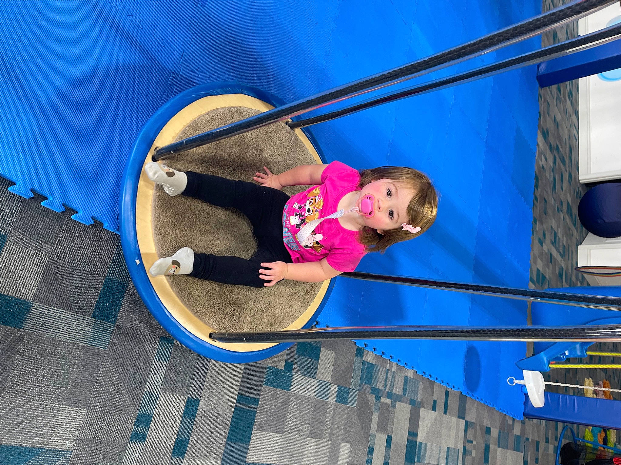 Julia is registered to the contest to win money with this photo: azure, blue, child, circle, city, electric_blue, fun, happy, hat, leisure, magenta, outdoor_play_equipment, person, play, recreation, t_shirt, toddler, tree, vacation, window