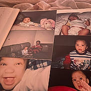 Winston Brown is registered to the contest to win money with this photo: baby, toddler, child, person, couch, plush_toy, adult, smile, close_up, indoor, photograph, bed, blanket, clothing, diaper, portrait, happy, family, nostalgia, album