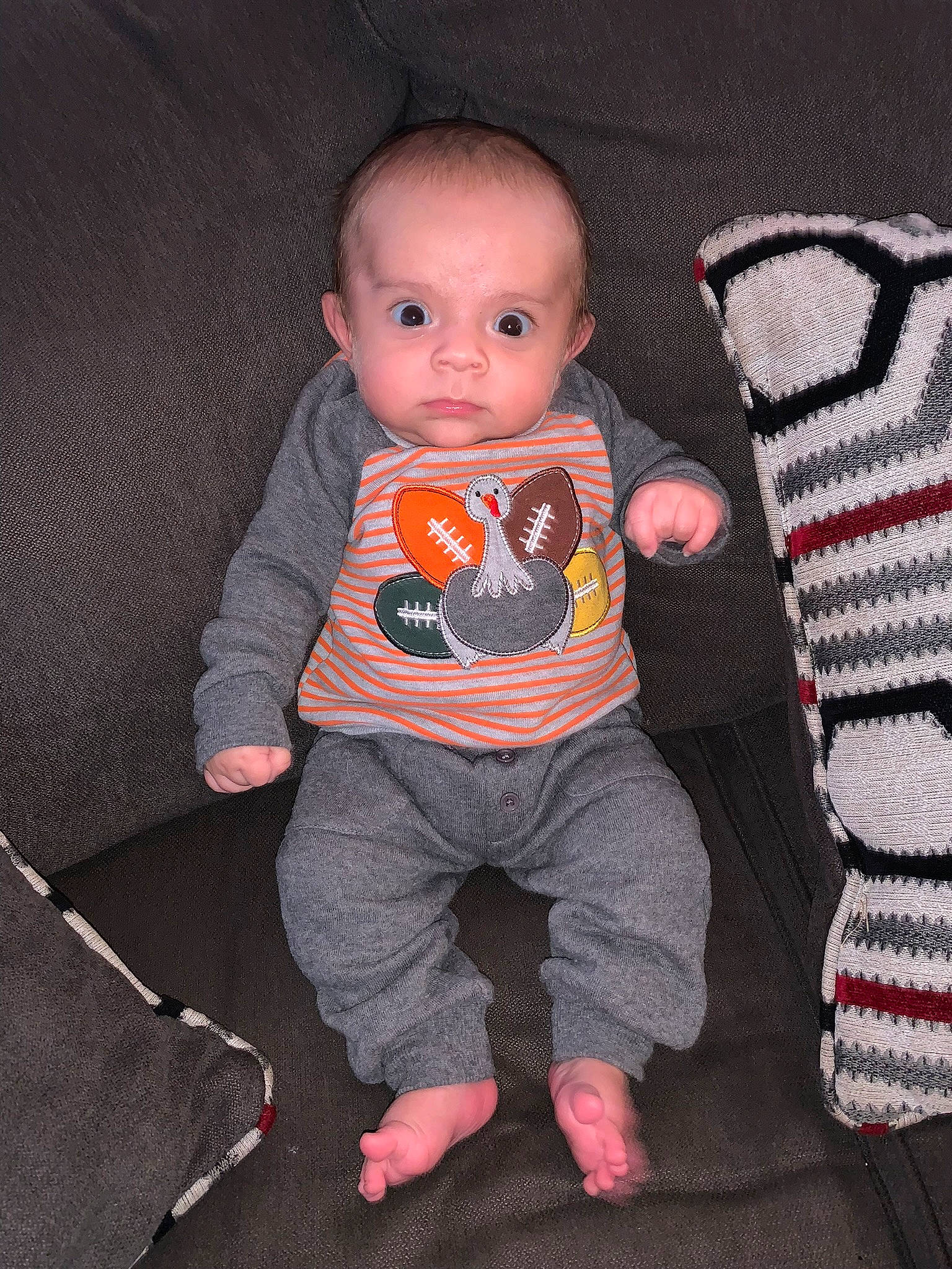 Mal joined the competition — help win amazing prizes! baby, baby_toddler_clothing, carmine, chair, cheek, child, comfort, doll, grey, head, linens, outerwear, pattern, person, pink, sitting, sleeve, sock, t_shirt, textile