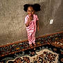 Covenant joined the competition — help win amazing prizes! child, girl, pajamas, pink, barefoot, carpet, patterned_rug, concrete_wall, indoor, playful, tongue_out, pointing, smiling, hair_puffs, person, floor, wall_socket, expression, cute, standing