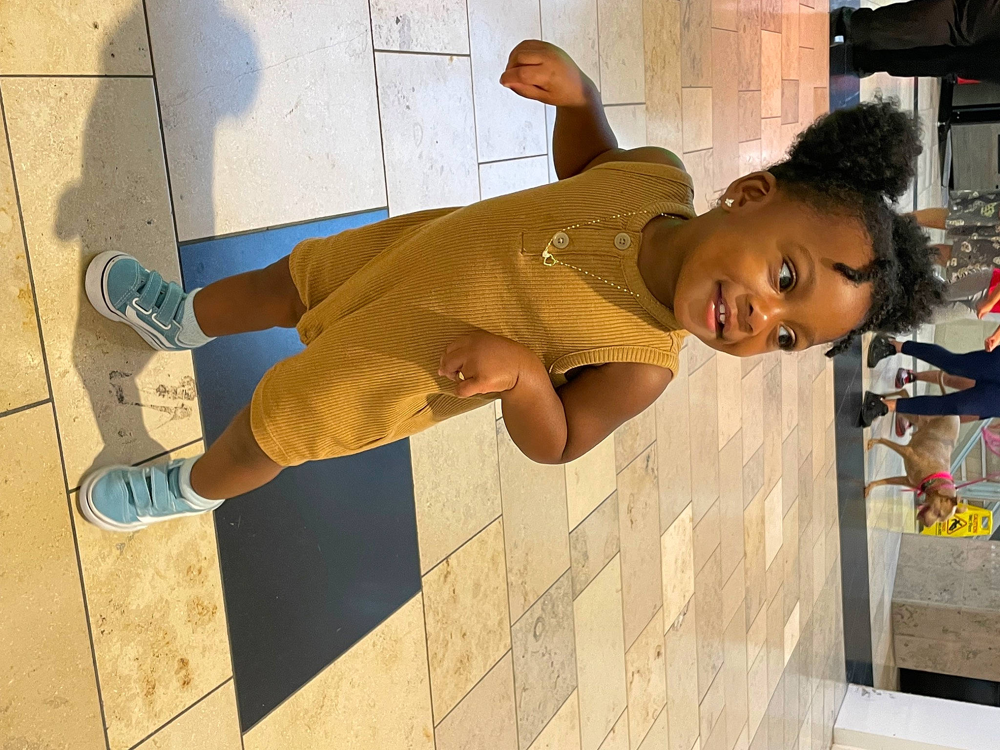 Eryn is registered to the contest to win money with this photo: child, elbow, eyewear, flooring, fun, glasses, happy, human_leg, joy, knee, leisure, person, room, shorts, sunglasses, t_shirt, thigh, toddler, waist