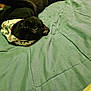 animal, bandana, bed, black_cat, blanket, cat, cozy, curious, cute, ears, eyes, feline, green, indoor, laying_down, pet, quilted, relaxed, upside_down, whiskers