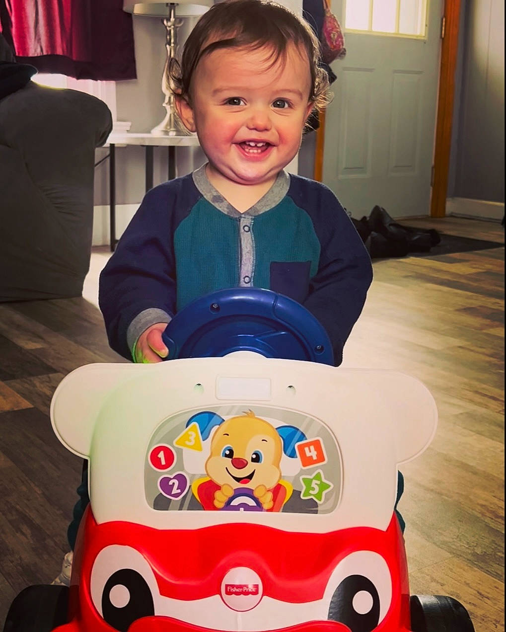 Colten is registered to the contest to win money with this photo: baby, baby_toddler_clothing, cheek, eye, face, facial_expression, hair, hairstyle, happy, head, human_body, organ, outerwear, person, photograph, pink, product, sleeve, smile, t_shirt
