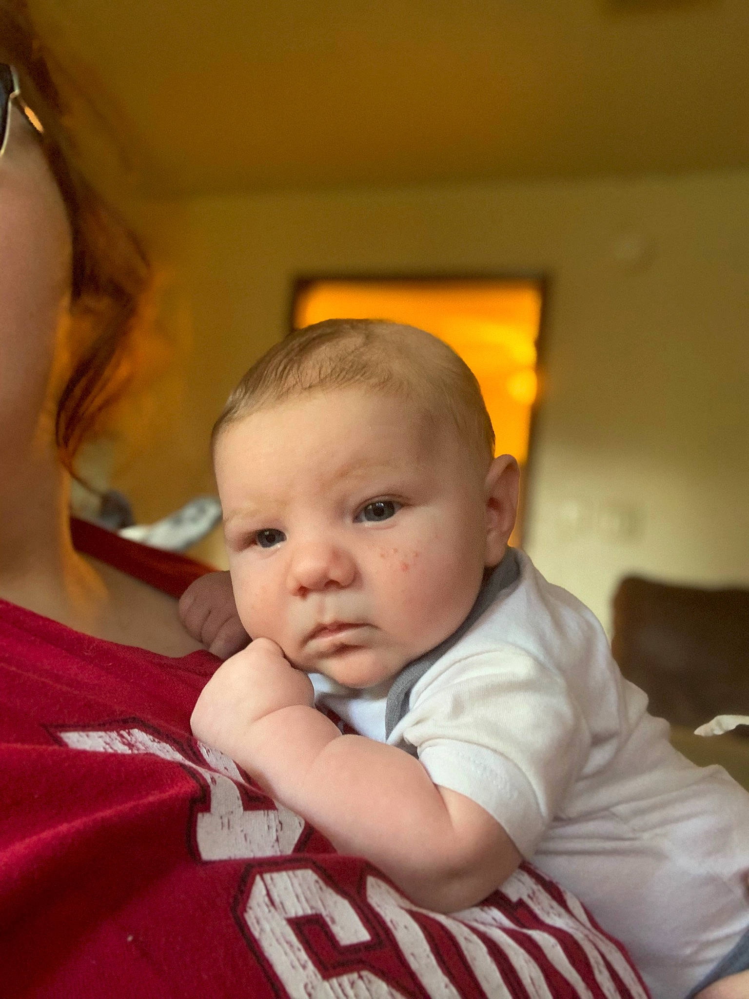 Kannon is registered to the contest to win money with this photo: baby, baby_toddler_clothing, cheek, child, chin, comfort, eyewear, fun, gesture, goggles, happy, iris, mouth, nose, person, room, sitting, skin, sleeve, sunglasses