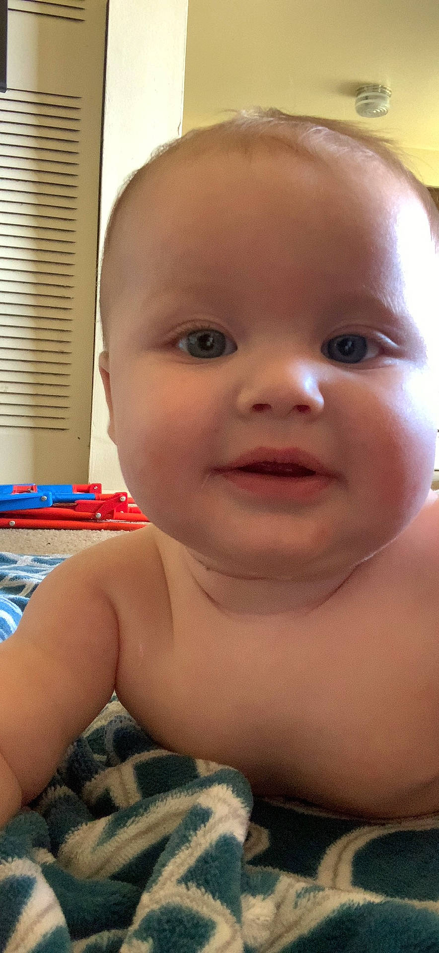 Mateo is registered to the contest to win money with this photo: baby, cheek, chest, child, chin, eye, eyebrow, eyelash, facial_expression, fun, happy, iris, joy, lip, mouth, nose, person, skin, standing, toddler