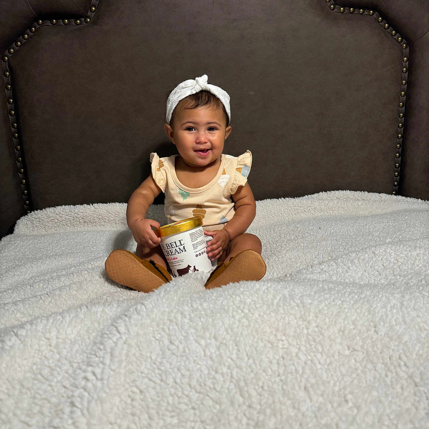 Bailey joined the competition — help win amazing prizes! baby, babylaughing, bodypart, clothing, couch, cream, dessert, face, finger, food, furniture, hand, happy, hat, head, person, photography, portrait, sitting, smile