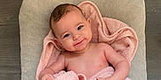 Gabie participe au concours pour gagner de l'argent avec cette photo : baby, child, smiling, towel, pink, skin, face, head, arm, hand, foot, leg, blanket, cushion, wood, floor, indoors, happy, portrait, infant