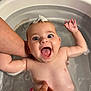 Gabie participe au concours pour gagner de l'argent avec cette photo : baby, bathtub, water, foam, hand, happy, smiling, skin, child, bath, naked, blue_eyes, playful, parent, splash, cute, infant, hygiene, tub, expression