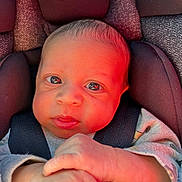 Jaylen is registered to the contest to win money with this photo: baby, infant, car_seat, evenflo, child, close_up, face, hands, seat_belt, clothing, expression, indoor, portrait, young_child, cute, newborn, head, skin, person, resting