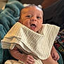 Jaylen joined the competition — help win amazing prizes! baby, infant, cloth, striped, blanket, hand, face, expression, happy, open_mouth, eyes, person, skin, soft, cozy, indoor, portrait, newborn, holding, child