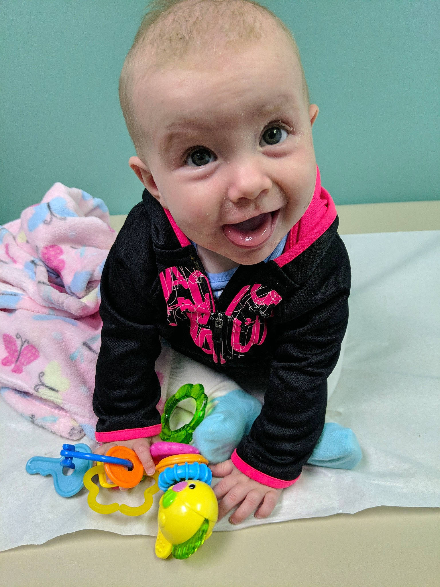 Annabelle joined the competition — help win amazing prizes! baby, baby_playing_with_toys, baby_products, baby_toddler_clothing, baby_toys, cheek, child, eye, face, head, person, play, skin, smile, toddler, toy, tummy_time