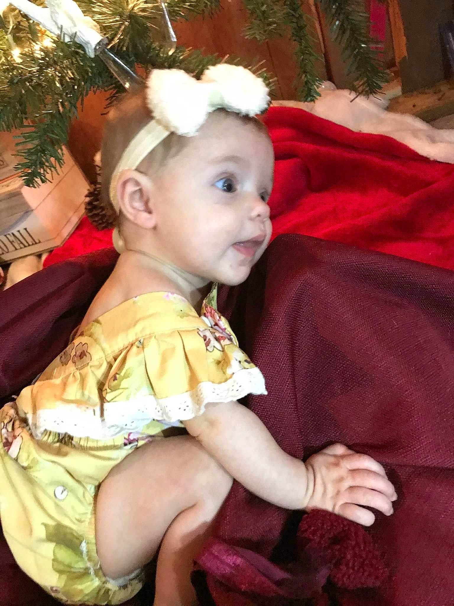 Worthy Grace is registered to the contest to win money with this photo: baby, baby_toddler_clothing, child, christmas, costume, costume_accessory, ear, embellishment, hair_accessory, headband, headpiece, person, sitting, toddler