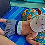 Mael Valentim a rejoint le concours — aidez-le/la à gagner de superbes lots ! baby, child, cap, hat, shorts, striped_shorts, blue_mat, cushion, towel, sunny, skin, barefoot, legs, arm, infant, relaxing, summer, outdoor, colorful, patterned