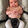 baby, infant, car_seat, cushion, clothing, white_leggings, socks, hands, face, head, cute, portrait, sitting, child, straps, safety_belt, indoors, expression, young, comfortable