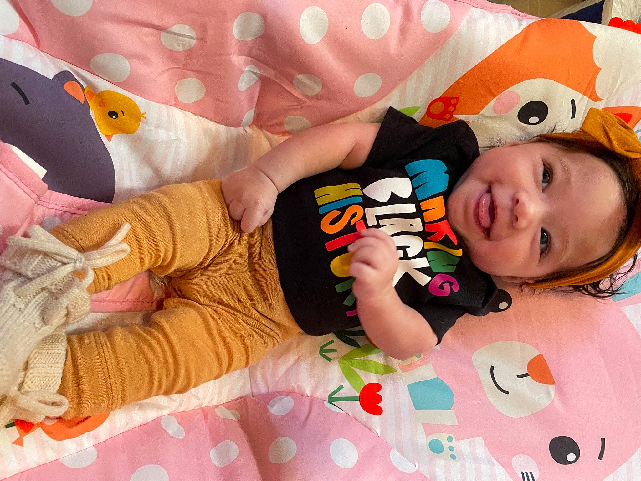 Kamila is registered to the contest to win money with this photo: baby, baby_products, baby_toddler_clothing, cheek, child, comfort, face, fun, happy, linens, pattern, person, pink, product, room, skin, sleeve, smile, t_shirt, textile
