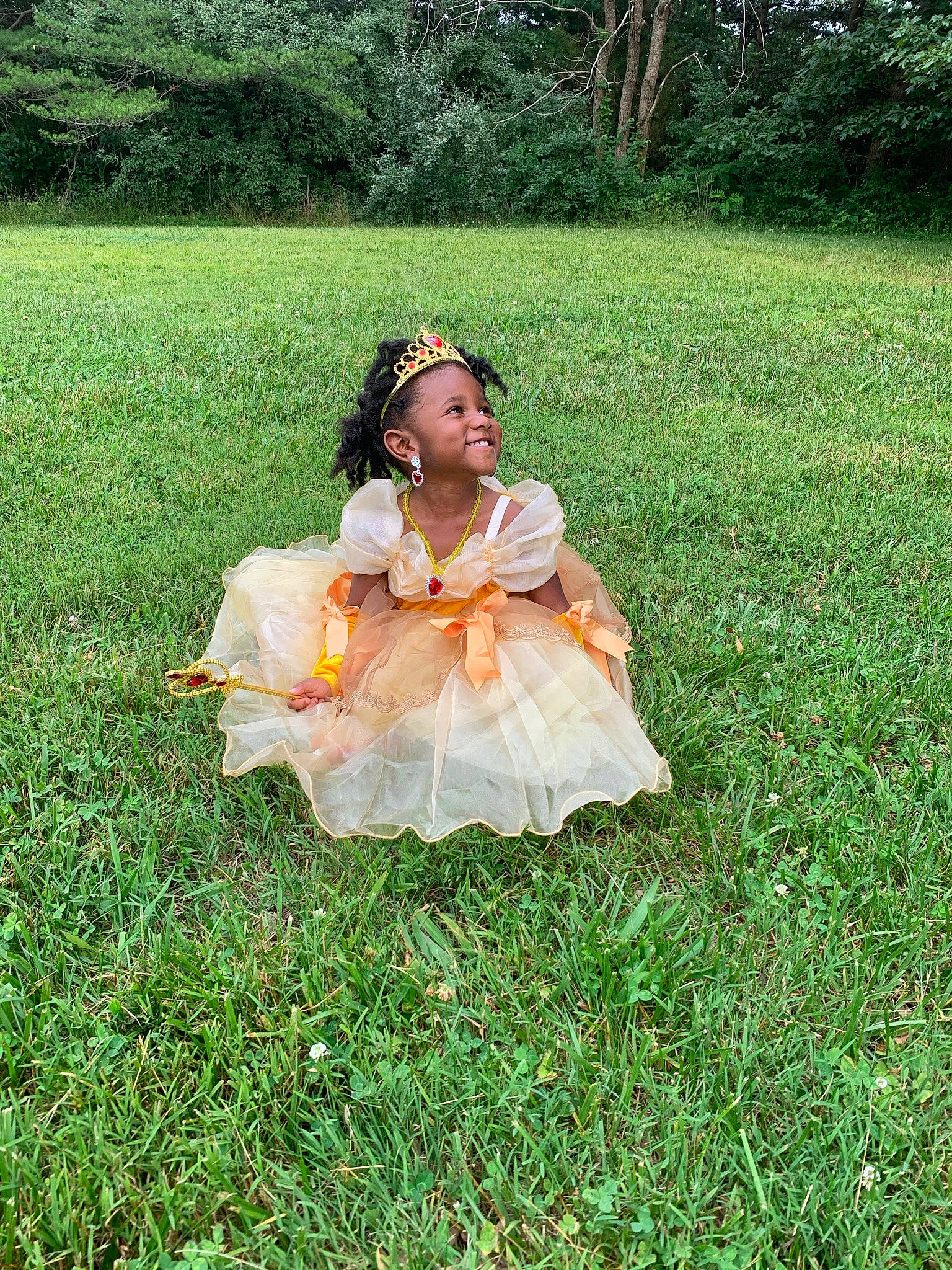 Nayeli is registered to the contest to win money with this photo: baby_toddler_clothing, child, dress, event, fun, garden, grass, grass_family, grassland, happy, joy, lawn, meadow, pasture, people_in_nature, person, plant, prairie, recreation, sitting