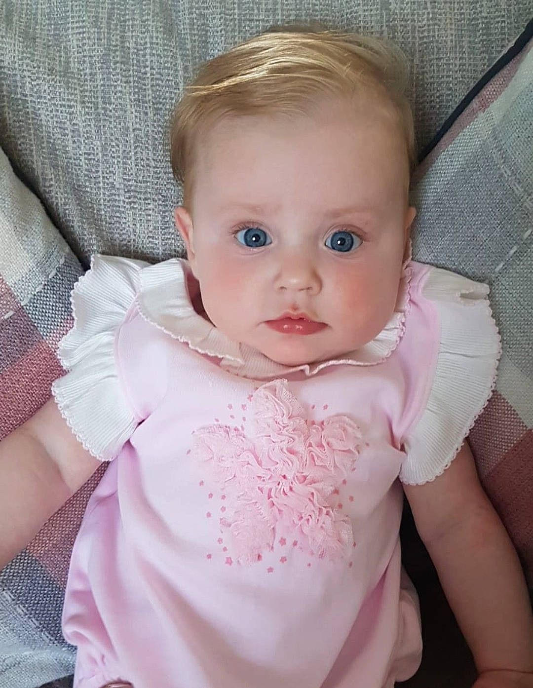 Maisy joined the competition — help win amazing prizes! baby, baby_products, beauty, blond, cheek, child, dress, eye, face, head, iris, lip, nose, person, pink, product, skin, smile, textile, toddler