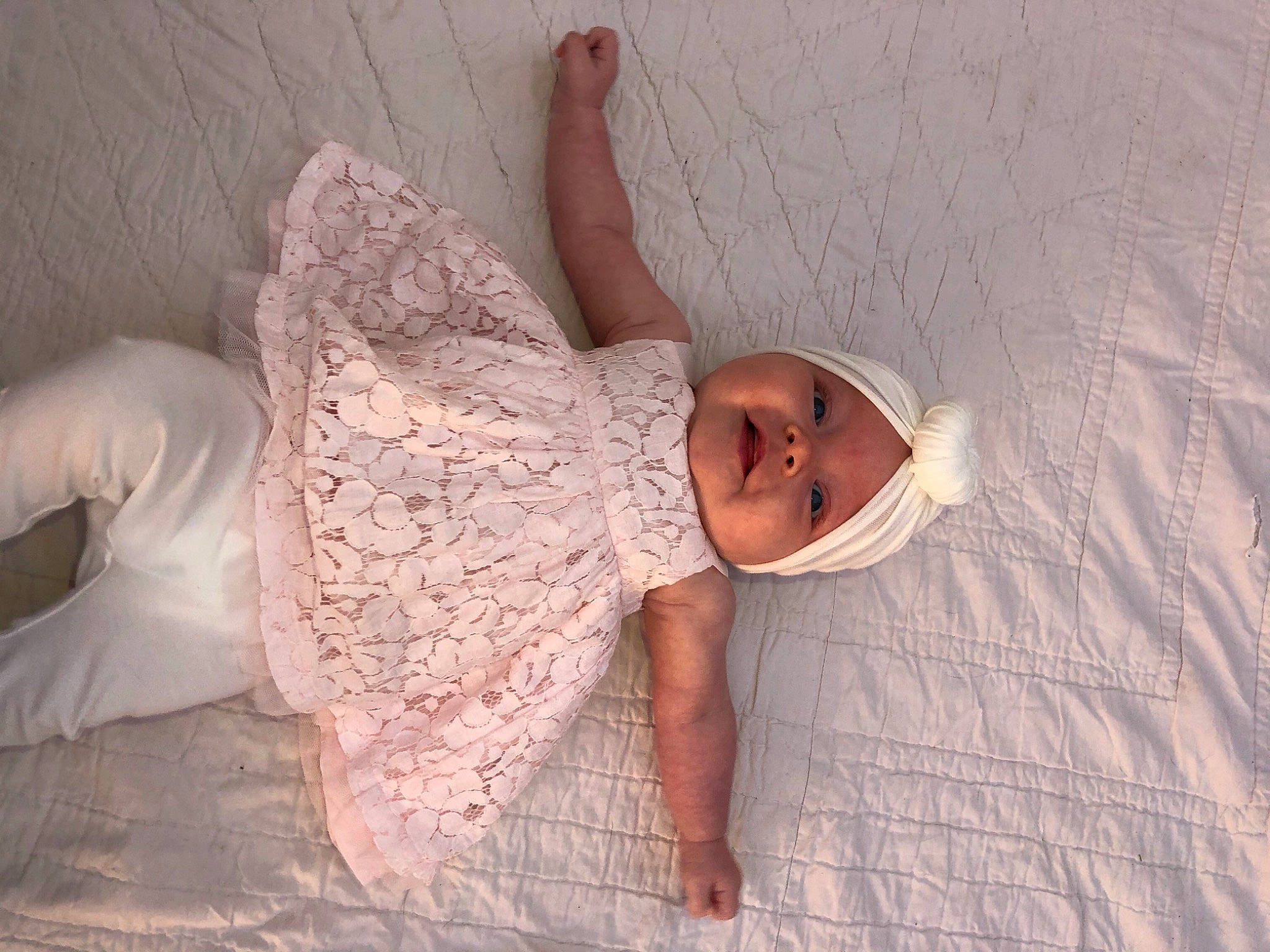 Kaylynn is registered to the contest to win money with this photo: arm, baby, beauty, child, dress, eye, fashion_accessory, hand, happy, headwear, lace, leg, linens, long_hair, person, photo_shoot, photography, pink, skin, smile