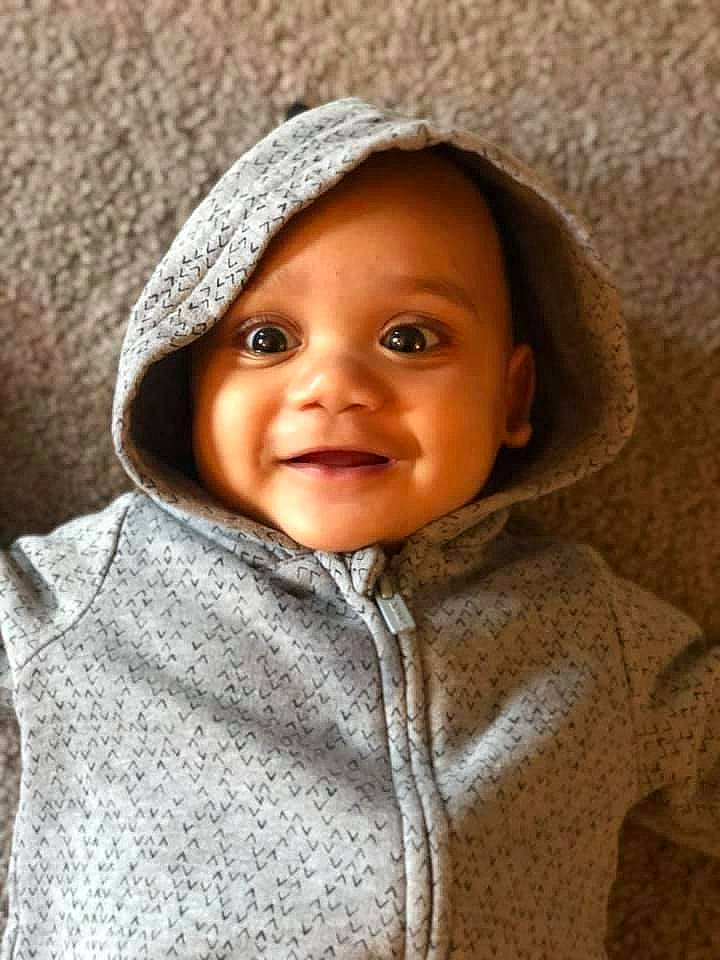 Kameron is registered to the contest to win money with this photo: baby, beige, cheek, child, child_model, eye, face, head, headgear, headwear, hood, hoodie, joy, outerwear, person, portrait, portrait_photography, skin, smile, toddler